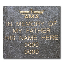 large gray brick with gold text